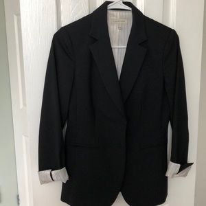 Chic black office blazer with stripped lining
